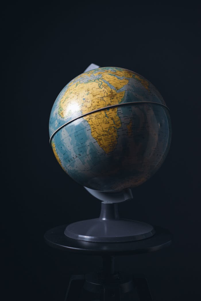 A classic globe on black background representing education and world geography.
